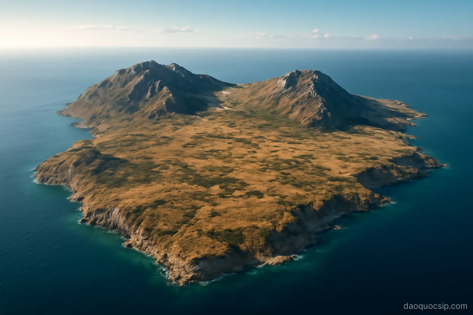 an aerial view of a mediterranean island with two mountain ranges and a flat central plain
